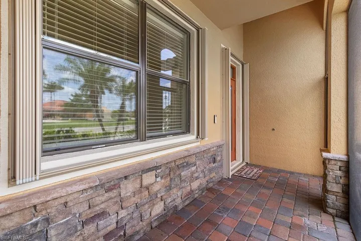 Front screened entry with room for seating