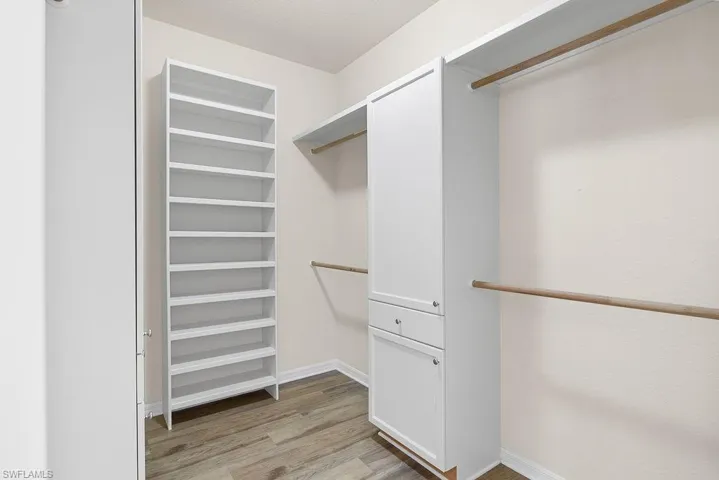 Primary walk-in closet with built-in storage