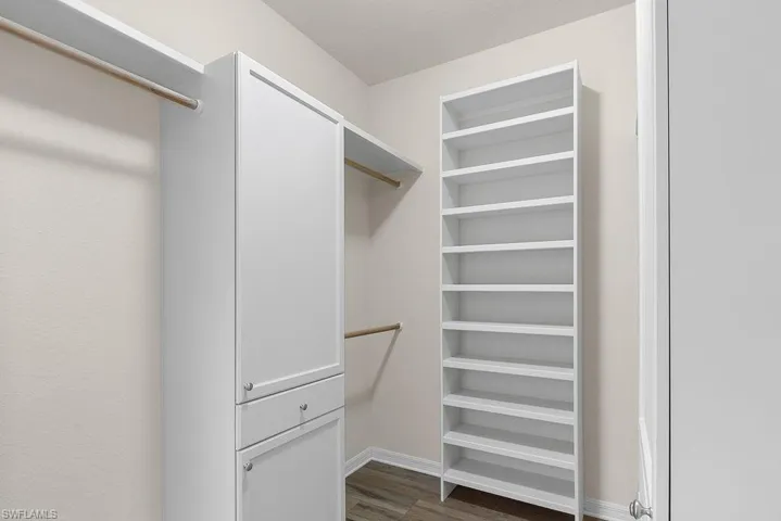 Primary walk-in closet with built-in storage