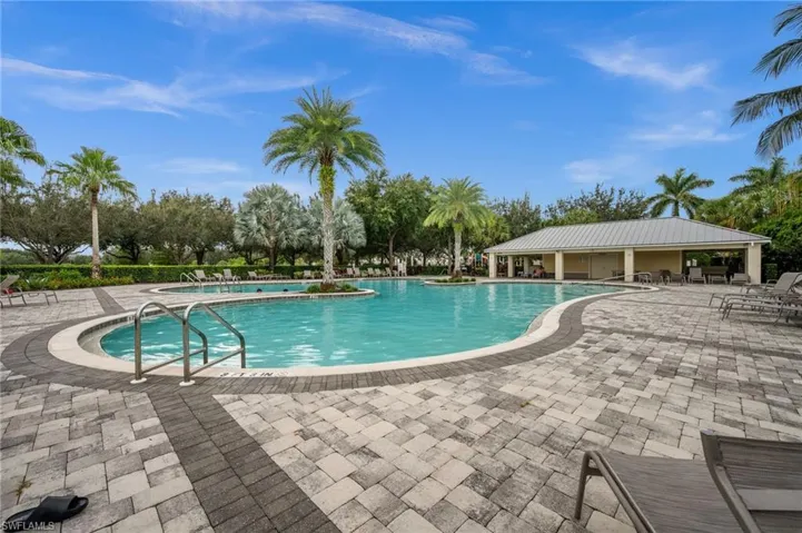 Community pool with a patio area