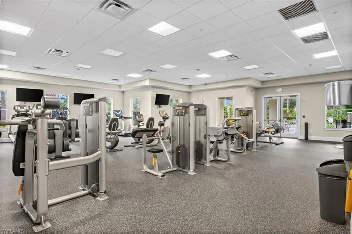 Workout area with a paneled ceiling