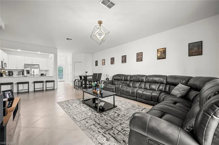 Living area featuring light tile patterned floors