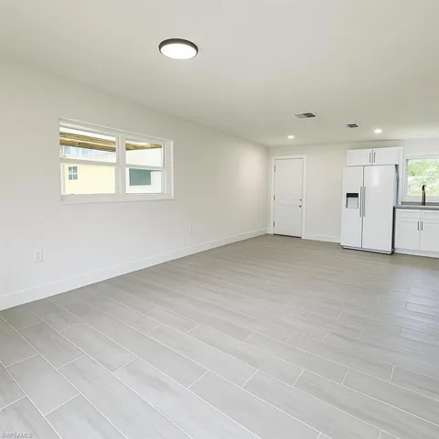 Spare room with recessed lighting and wood finish floors