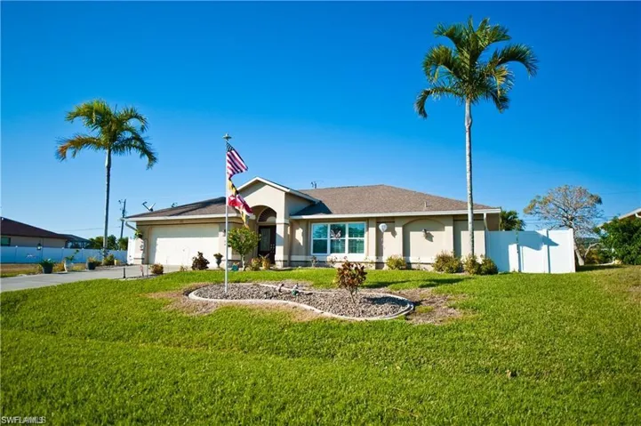 Lush green grass and a large front yard