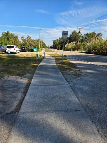 View of asphalt road with sidewalks