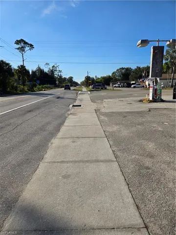 View of asphalt road with sidewalks