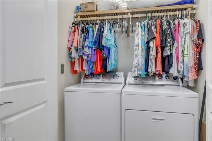 Laundry room featuring separate washer and dryer
