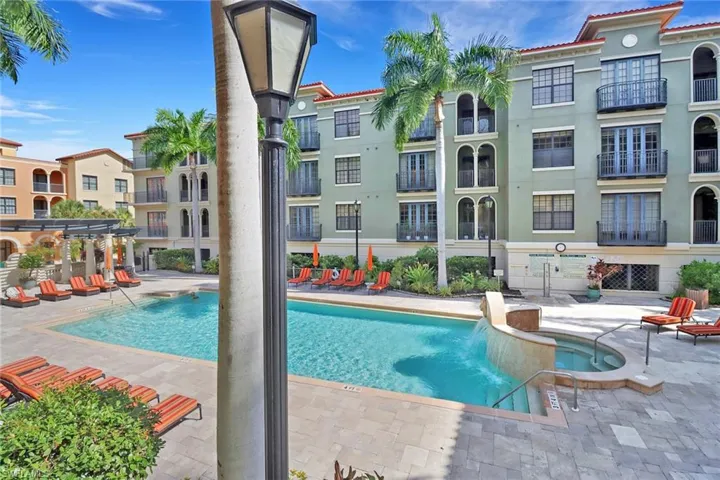View of swimming pool featuring a patio area and pool water feature