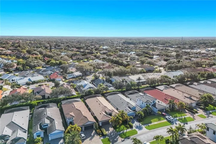 Aerial overview of property's location featuring nearby suburban area