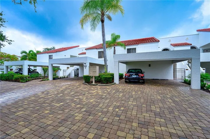 Mediterranean / spanish-style house featuring a carport