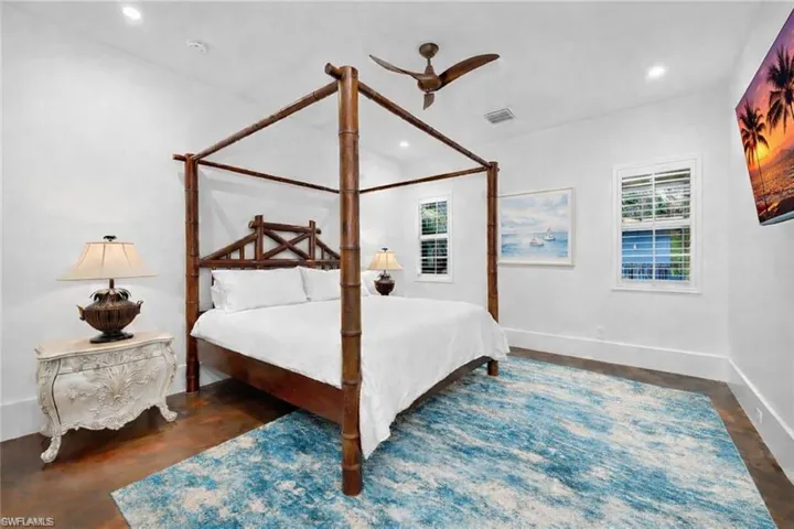 Bedroom featuring a ceiling fan, recessed lighting, and concrete flooring