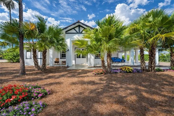 Back of house with stucco siding and a patio area