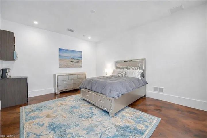 Bedroom with baseboards and recessed lighting