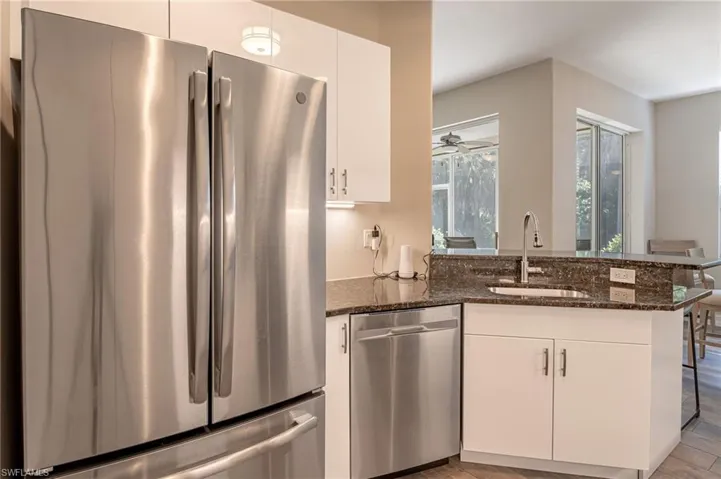 Stainless Steel Appliances and White Cabinets