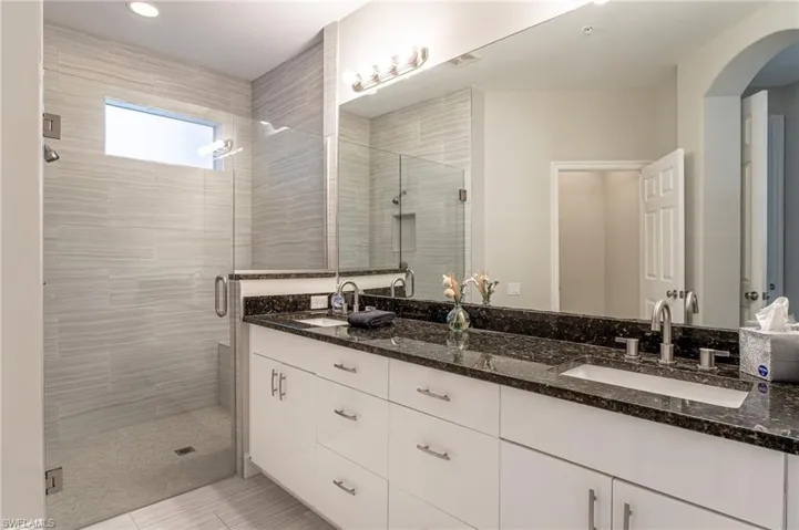 Dual Vanity Sinks and Tile Shower