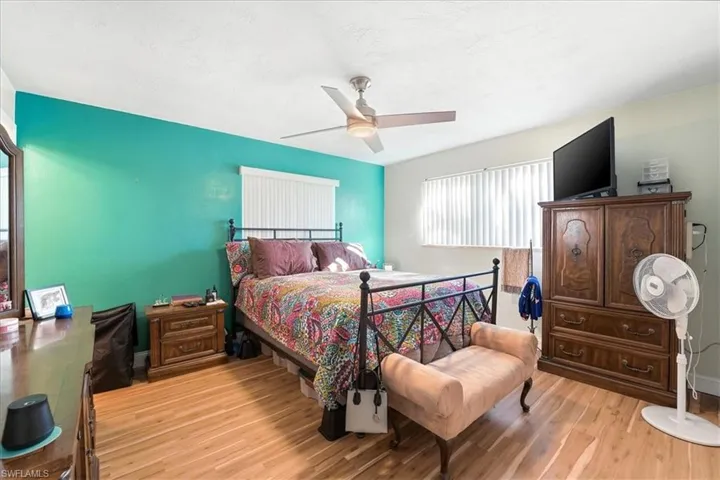 Bedroom featuring light wood-type flooring and ceiling fan