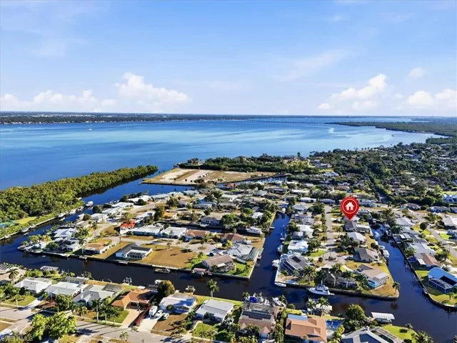 Aerial perspective of suburban area with a nearby body of water