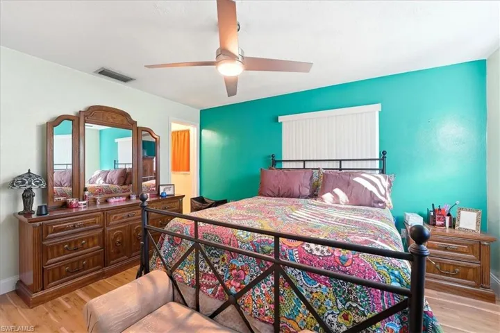 Bedroom featuring light wood-style flooring and a ceiling fan