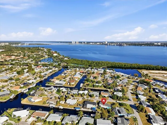 View of property location featuring nearby suburban area and a nearby body of water