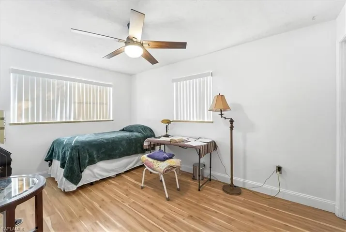 Bedroom featuring ceiling fan and light wood finished floors