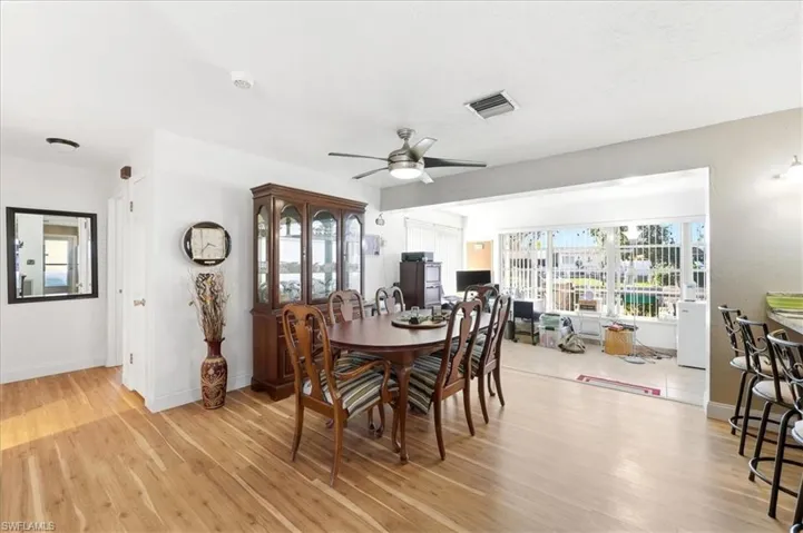 Dining room featuring light wood finished floors and a ceiling fan