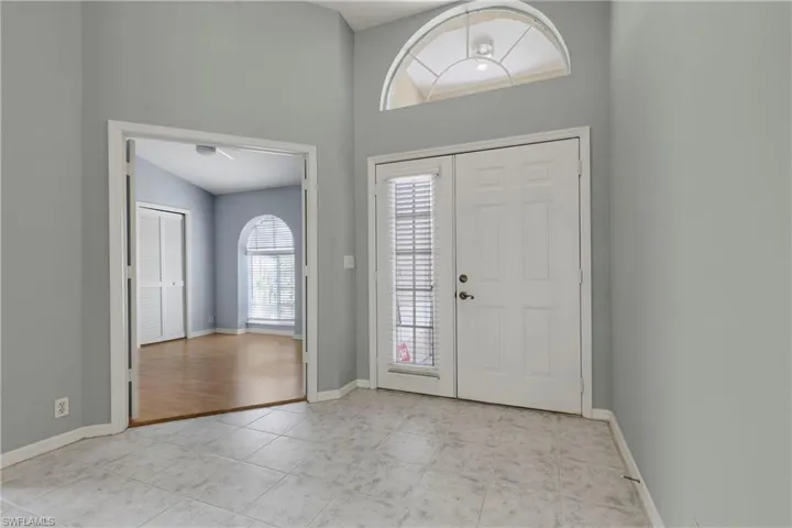 Foyer entrance with baseboards