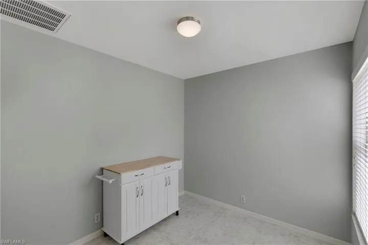 Unfurnished bedroom with baseboards