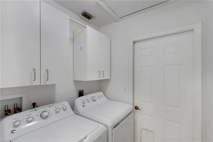 Laundry room with cabinet space and independent washer and dryer