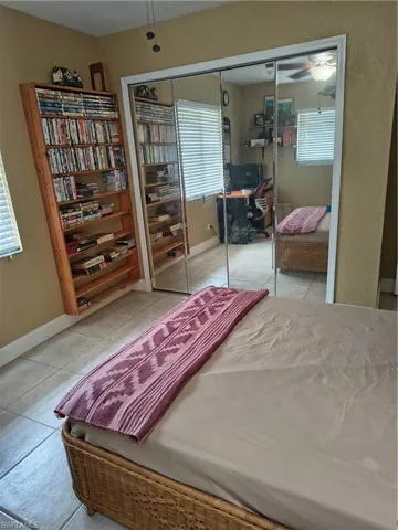 Room featuring a full wall of mirrored sliding closet doors