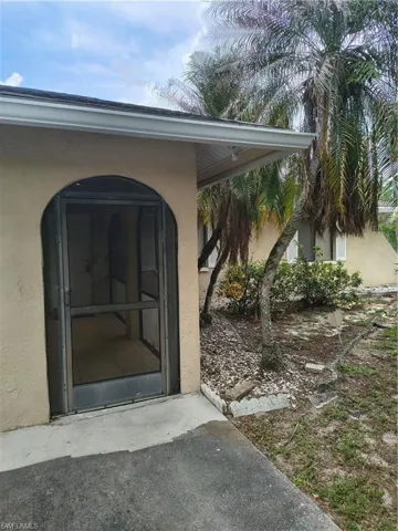 Arched entry with a screened door