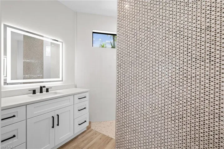 Master bathroom featuring dual  vanities