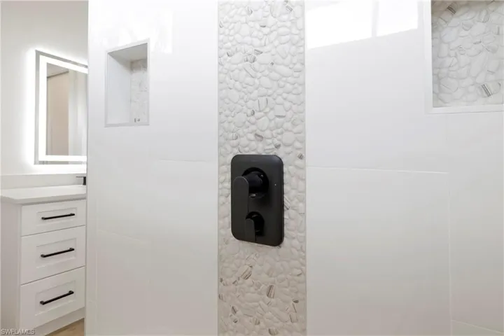 Details with walk in shower and vanity master bath