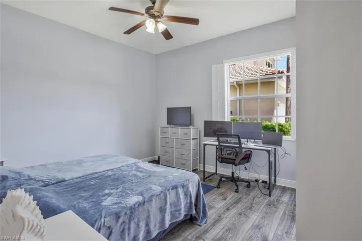 Bedroom featuring ceiling fan and hardwood / wood-style floors