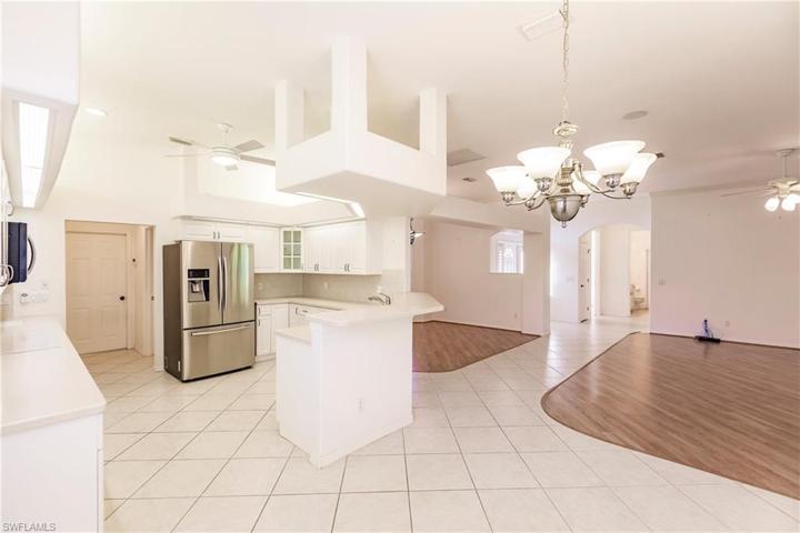 From breakfast area, into kitchen, dining and living area