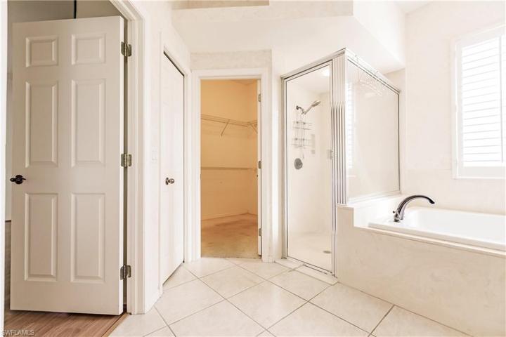 Owners bath features tub, shower and walk in closet