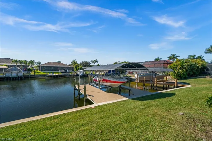 Private dock with boat lift and canopy