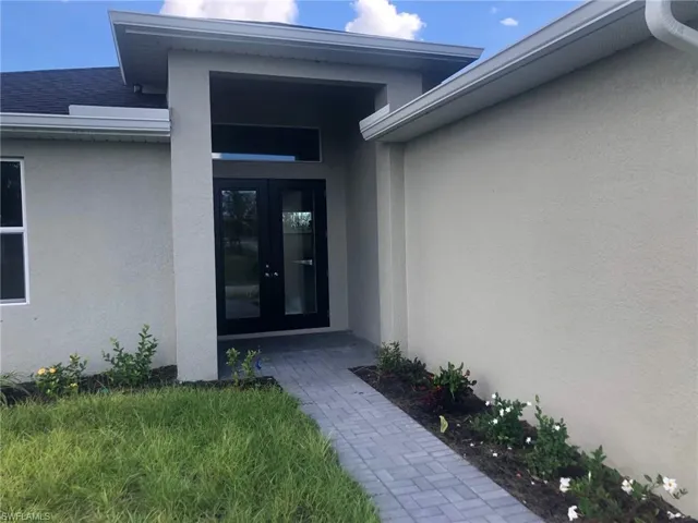 View of exterior entry featuring french doors
