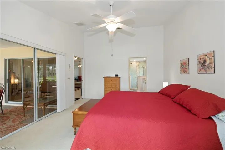 Room featuring vaulted ceilings and a ceiling fan
