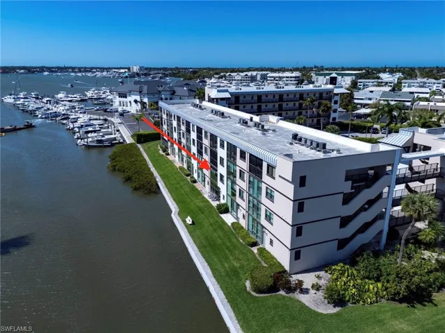 Aerial view of a nearby body of water and apartment complex