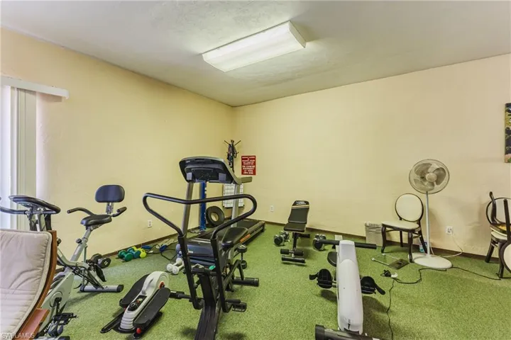 Workout area featuring a textured wall