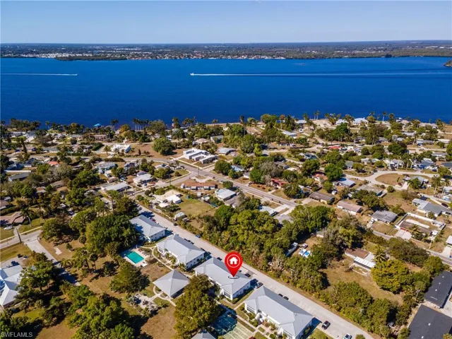 Aerial view of residential area featuring a large body of water