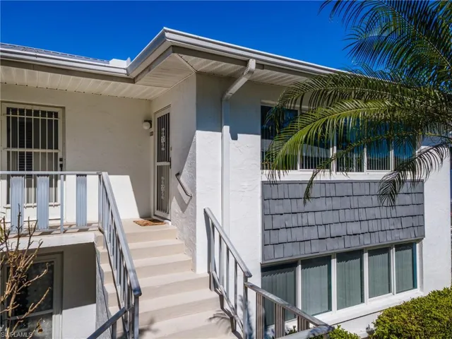 Property entrance with stucco siding