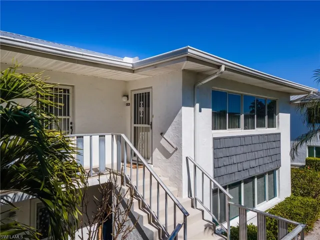 Entrance to property featuring stucco siding