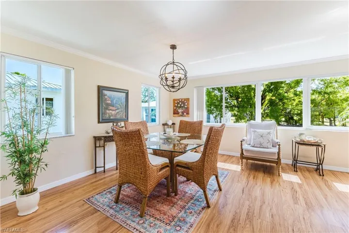 Dining room featuring a chandelier, light wood-style floors, and plenty of natural light