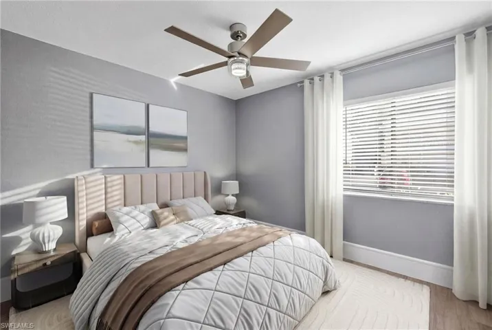 Bedroom featuring light wood-style floors and ceiling fan