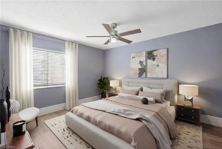 Bedroom with wood finished floors, a ceiling fan, and a textured ceiling
