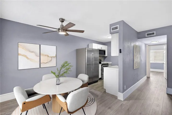 Dining room featuring light wood finished floors and ceiling fan