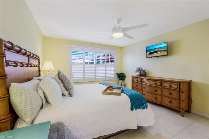 Primary bedroom with plantation shutters