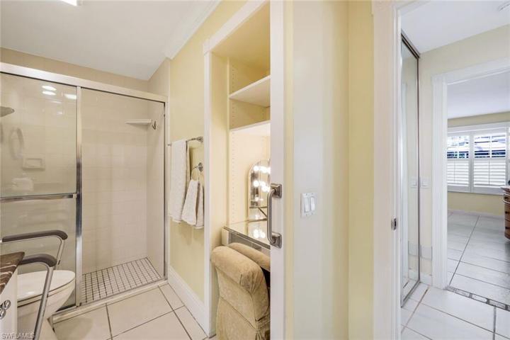 Primary bathroom with dual sinks, shower and makeup area.