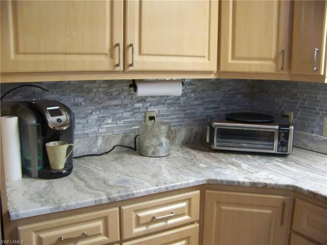 Beautiful kitchen granite and glass backsplash!